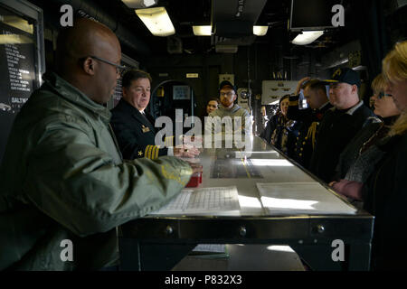 NEW YORK (Nov. 12, 2016) – Capt. James R. Midkiff, commanding officer, amphibious assault ship USS Iwo Jima (LHD 7) leads a tour of the ship. Iwo Jima is participating in Veterans Week New York City 2016 to honor the service of all our nation’s veterans. The ship recently returned from the humanitarian assistance mission to Haiti in the aftermath of Hurricane Matthew Stock Photo