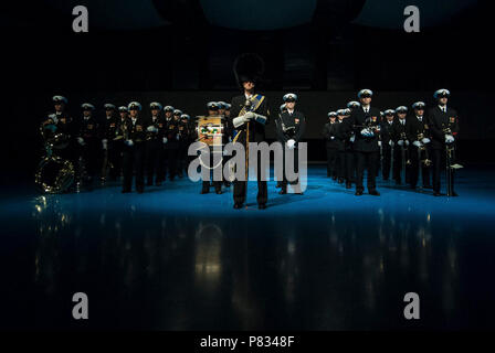 ARLINGTON, Va. (Feb. 6, 2017) The United States Navy Ceremonial Band prepares to play at the arrival of the French Chief of Defense Staff, General Pierre de Villiers.  The Ceremonial Band has two roles in a high-level ceremony of this nature: display the pride and heritage of today's Navy and pay respect to France for its continued partnership. Stock Photo