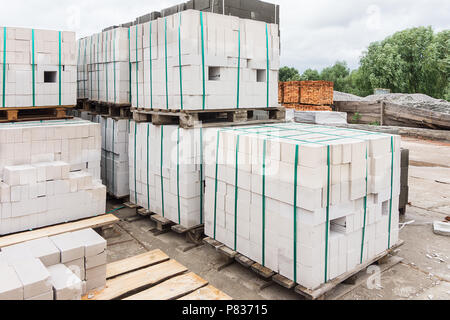 White bricks stacked on pallets Stock Photo