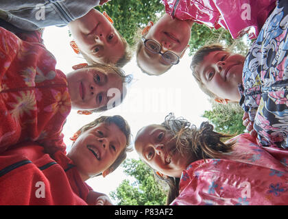 Germany, Berlin. 21st June, 2018. The Sechslinge from Berlin are in their new garden. The Sechslinge will be 10 years old in October. (Clockwise from above: Esma, Zehra, Rana, Adem, Zeynep, Ahmed. Credit: Annette Riedl/dpa/Alamy Live News Stock Photo