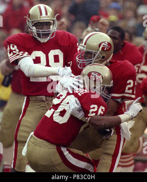 San Francisco 49ers Don Griffin (29) and Tim McKyer (22) celebrate after  breaking up a Denver Broncos pass from John Elway to wide receiver Mark  Jackson, right, during Super Bowl XXIV in