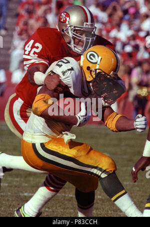 San Francisco, California, USA. 19th Nov, 1989. San Francisco 49ers vs Green  Bay Packers at Candlestick Park Sunday, November 19, 1989. Packers beat  49ers 21-17. 49er defensive back Ronnie Lott (42) stops Packer running back  Brent Fullwood Credit