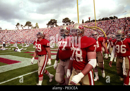 Stanford, California, USA. 22nd Oct, 1989. San Francisco 49ers vs New  England Patriots at Stanford Stadium Sunday, October 22, 1989. 49ers Beat  Patriots 37-20. Heading on field Bruce Collie (69), Bubba Paris (77) and Pierce  Holt Credit: Al Golub/ZUMA