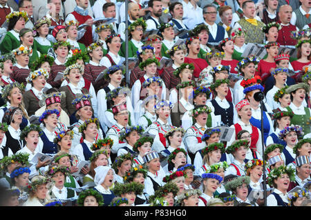 Riga, Latvia. 8th July, 2018. Choir members in national costumes perform during the closing concert of Latvia's XXVI Nationwide Song and XVI Dance Celebration in Riga, Latvia, on July 8, 2018. This concert concluded the week-long national song and dance celebration in which about 43,000 dancers and singers from Latvia and abroad participated. Credit: Janis/Xinhua/Alamy Live News Stock Photo