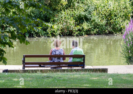 Northampton. U.K. 9th July 2018. Weather. People enjoying the cooler Monday morning air  by the lake in Abington Park before the heat of the day. Credit: Keith J Smith./Alamy Live News Stock Photo