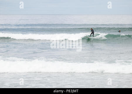 Strandhill, Sligo, Ireland. 8th July 2018: Surfers enjoying the great weather and Atlantic waves surfing in Strandhill in county Sligo - one of the best places in Europe to surf. Stock Photo