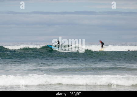 Strandhill, Sligo, Ireland. 8th July 2018: Surfers enjoying the great weather and Atlantic waves surfing in Strandhill in county Sligo - one of the best places in Europe to surf. Stock Photo