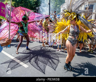 Colourful flamboyant costumes at St Paul's carnival in Bristol UK Stock Photo