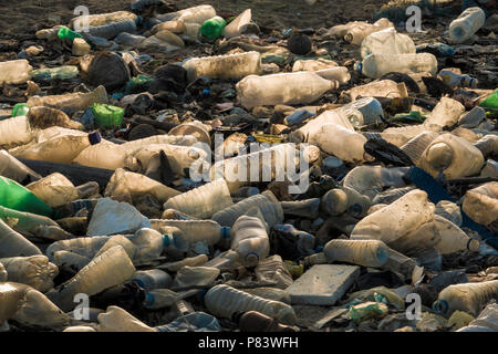 Empty single use plastic drink bottles and other trash on beach in Negombo, Sri Lanka Stock Photo