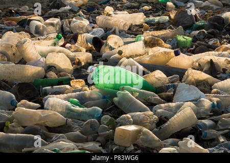 Empty single use plastic drink bottles and other trash on beach in Negombo, Sri Lanka Stock Photo