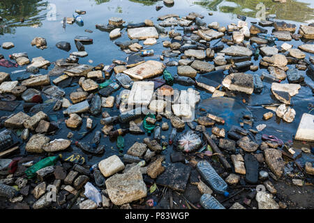 Plastic bottles, polystyrene and other garbage floating in ocean in Negombo, Sri Lanka Stock Photo