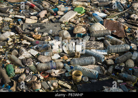 Plastic bottles, polystyrene and other assortment of trash completely cover an estuary beach in Negombo, Sri Lanka Stock Photo