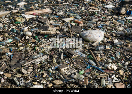 Plastic bottles, polystyrene and other assortment of trash completely cover an estuary beach in Negombo, Sri Lanka Stock Photo