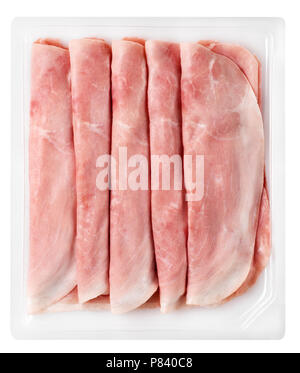Flat lay view of baked ham slices lying in white tray Stock Photo