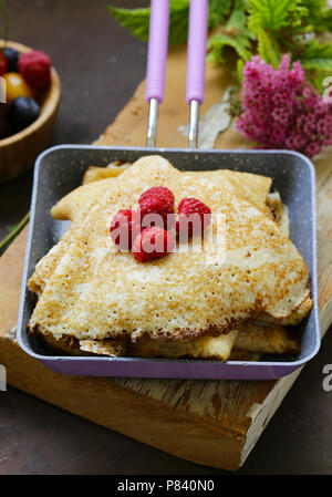 thin pancakes stack in a frying pan, rustic still life Stock Photo - Alamy