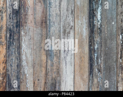 Old wooden plank background of the house fence in the country village. Stock Photo