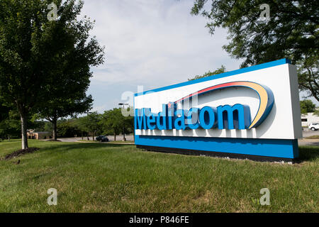 A logo sign outside of a facility occupied by Mediacom Communications Corporation in West Des Moines, Iowa, on June 30, 2018. Stock Photo