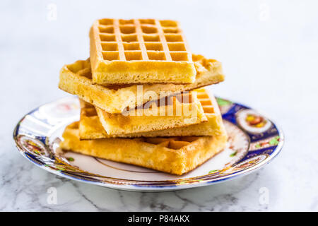 Close-up several waffles on rustic plate. Stock Photo