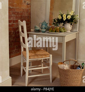 Hand-painted decoration on double doors in traditional with rush-seated  ladder-back chair and terracotta tiled floor Stock Photo - Alamy