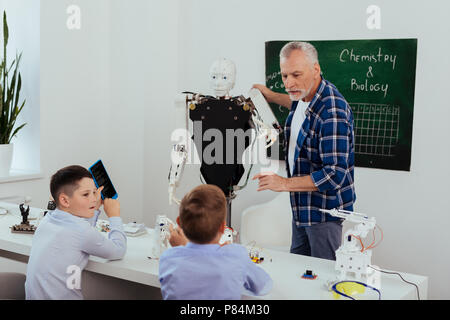 Nice smart man giving a lesson Stock Photo