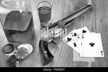 Dead mans hand aces and eights with Wild Bill's six shooter in black and white. Stock Photo