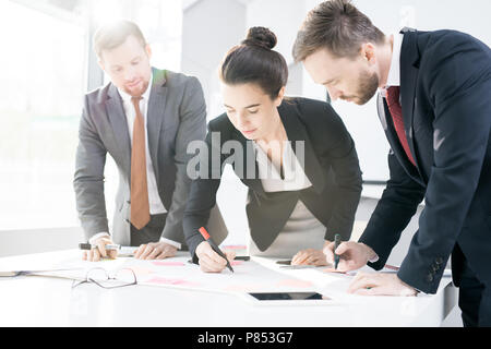 Business Team Writing Plans Stock Photo