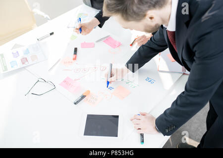 Business People Writing Plans Stock Photo