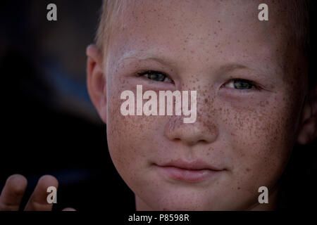 a portrait of a freckle face boy in Kazakistan. Stock Photo