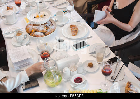 Served banquet table with drinks and desserts Stock Photo