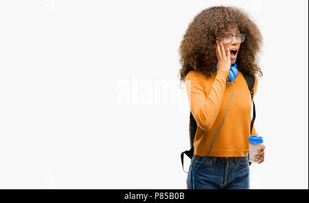 African american student woman stressful keeping hands on head, terrified in panic, shouting Stock Photo