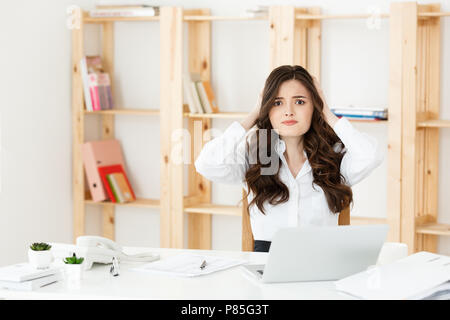 Worried stressed depressed office worker business woman. Looking desperate and confused. Disciplinary action and dismissal.Getting fired.Problems at work Stock Photo