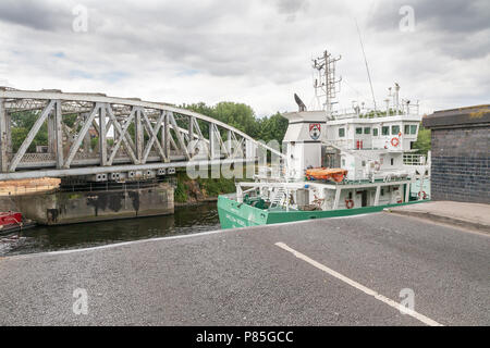 Arklow Rebel, a 13 year old General Cargo Ship from Ireland travels along the Manchester Ship Canal, through the open Swing Bridge at Stockton Heath