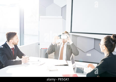 Businessman Enjoying VR in Meeting Stock Photo