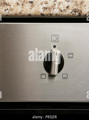 close up shot of oven time button Stock Photo