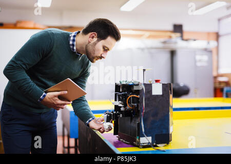 Young student of robotics working on project Stock Photo