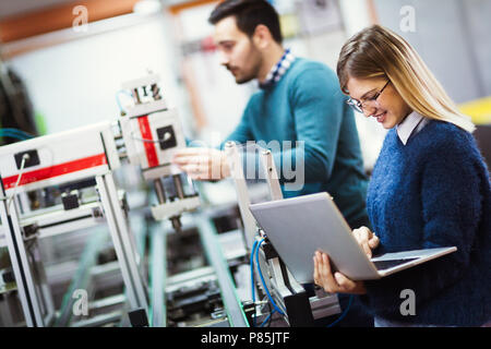 Young students of electronics working on project Stock Photo