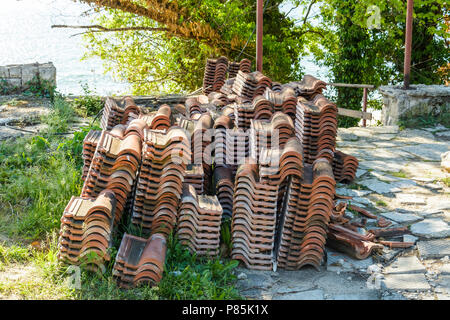 Stack of roof tiles near a construction site Stock Photo