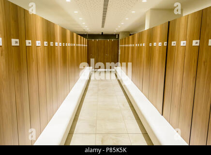 Modern Storage lockers in a swimming pool with bench , and led lighting Stock Photo