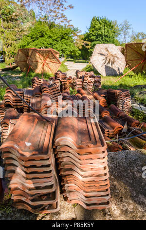 Stack of roof tiles near a construction site Stock Photo