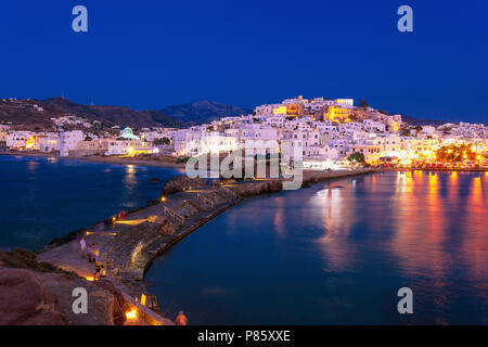 Chora of Naxos island as seen from the famous landmark the Portara with the natural stone walkway towards the village, Cyclades, Greece. Stock Photo