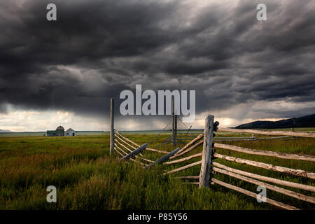 WY02775-00...WYOMING - Storm aproaching historic building in Grand Teton National Park along Mormon Road. Stock Photo