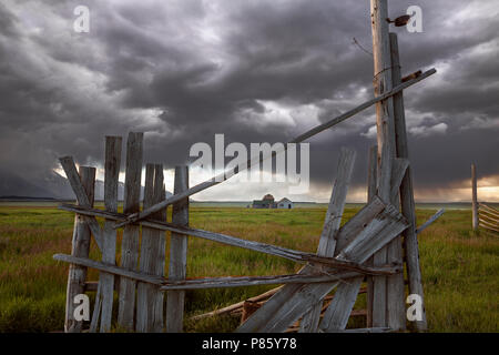 WY02776-00...WYOMING - Storm aproaching historic building in Grand Teton National Park along Mormon Road. Stock Photo