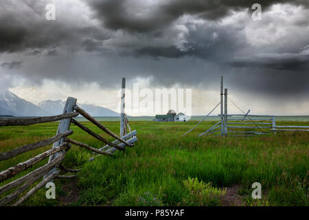 WY02777-00...WYOMING - Storm aproaching historic building in Grand Teton National Park along Mormon Road. Stock Photo