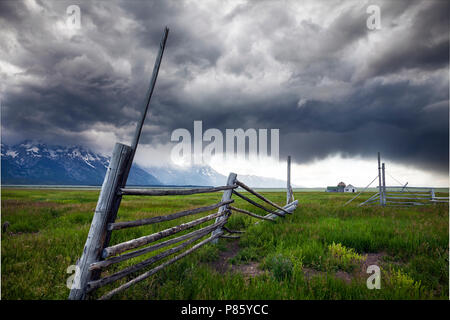 WY02778-00...WYOMING - Storm aproaching historic building in Grand Teton National Park along Mormon Road. Stock Photo