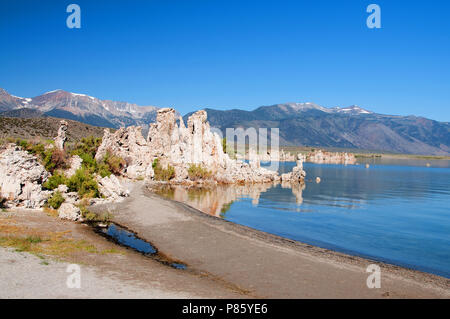 Mono Lake's most distinctive feature are the eerie tufa towers - mineral structures created by freshwater springs bubbling up through alkaline waters. Stock Photo