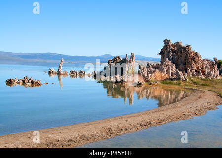 Mono Lake's most distinctive feature are the eerie tufa towers - mineral structures created by freshwater springs bubbling up through alkaline waters. Stock Photo