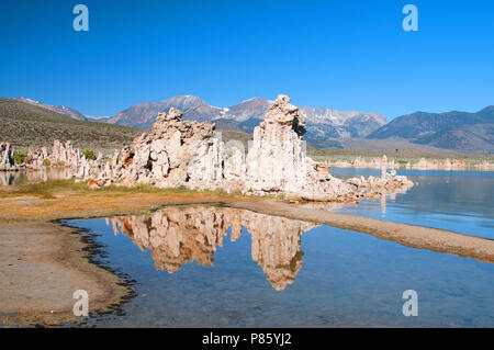 Mono Lake's most distinctive feature are the eerie tufa towers - mineral structures created by freshwater springs bubbling up through alkaline waters. Stock Photo