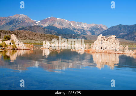 Mono Lake's most distinctive feature are the eerie tufa towers - mineral structures created by freshwater springs bubbling up through alkaline waters. Stock Photo