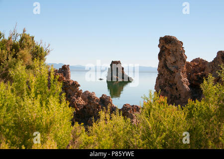 Mono Lake's most distinctive feature are the eerie tufa towers - mineral structures created by freshwater springs bubbling up through alkaline waters. Stock Photo