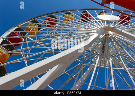 Close up view of a bright Ferris Wheel with clear blue sky background Stock Photo
